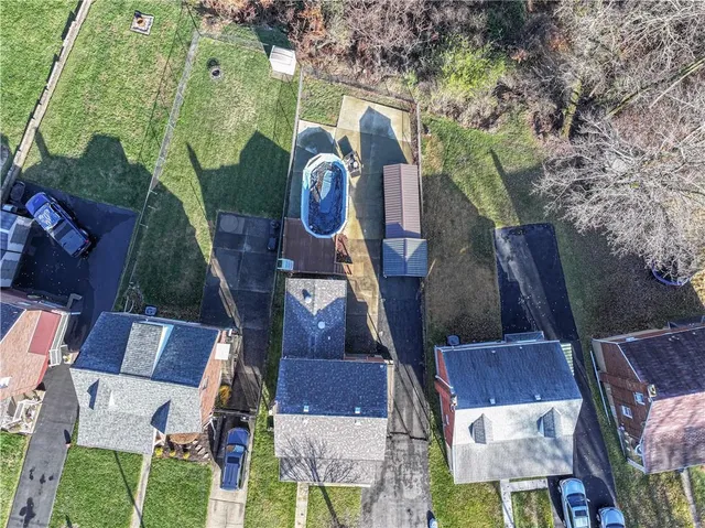an aerial view of houses with outdoor space