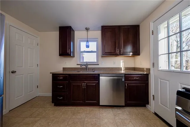 a kitchen with a stove and a sink