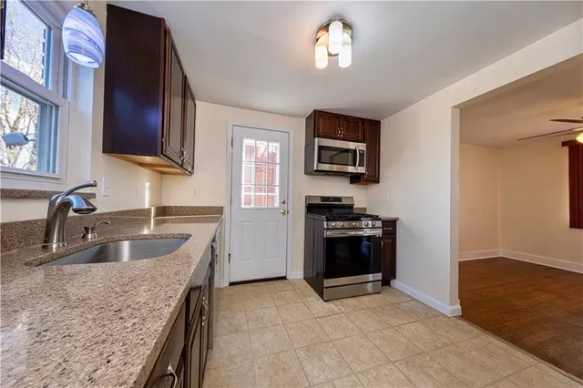 a kitchen with a stove and a sink
