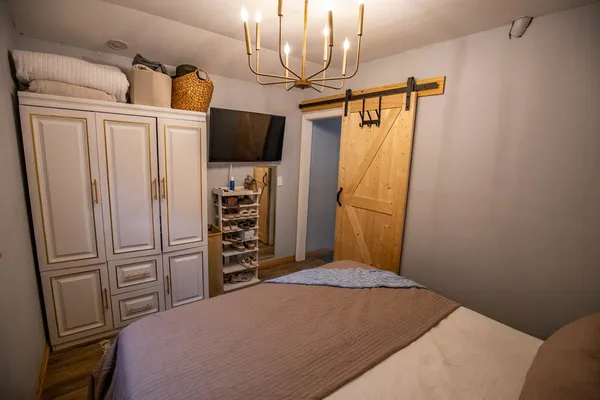 a bathroom with a sink vanity mirror and toilet