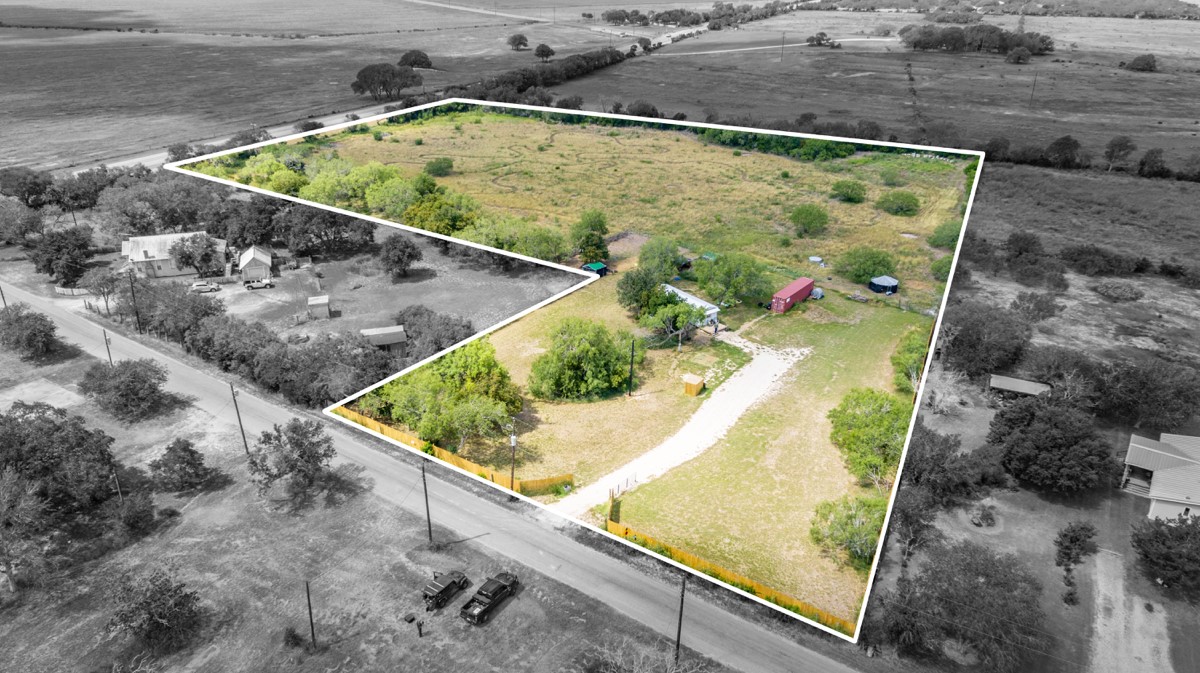 143 Harrison Road Beeville, TX 78102 - Photo 5 of 39 Aerial view of sparsely populated area featuring property boundaries highlighted