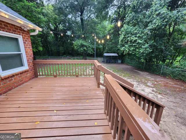 a view of outdoor space with deck and yard