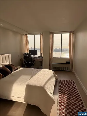a bedroom with a bed and a walk in closet