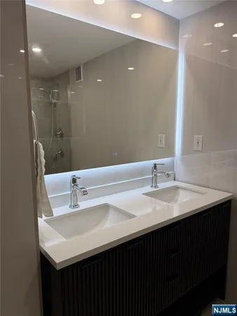 a bathroom with a toilet and shower