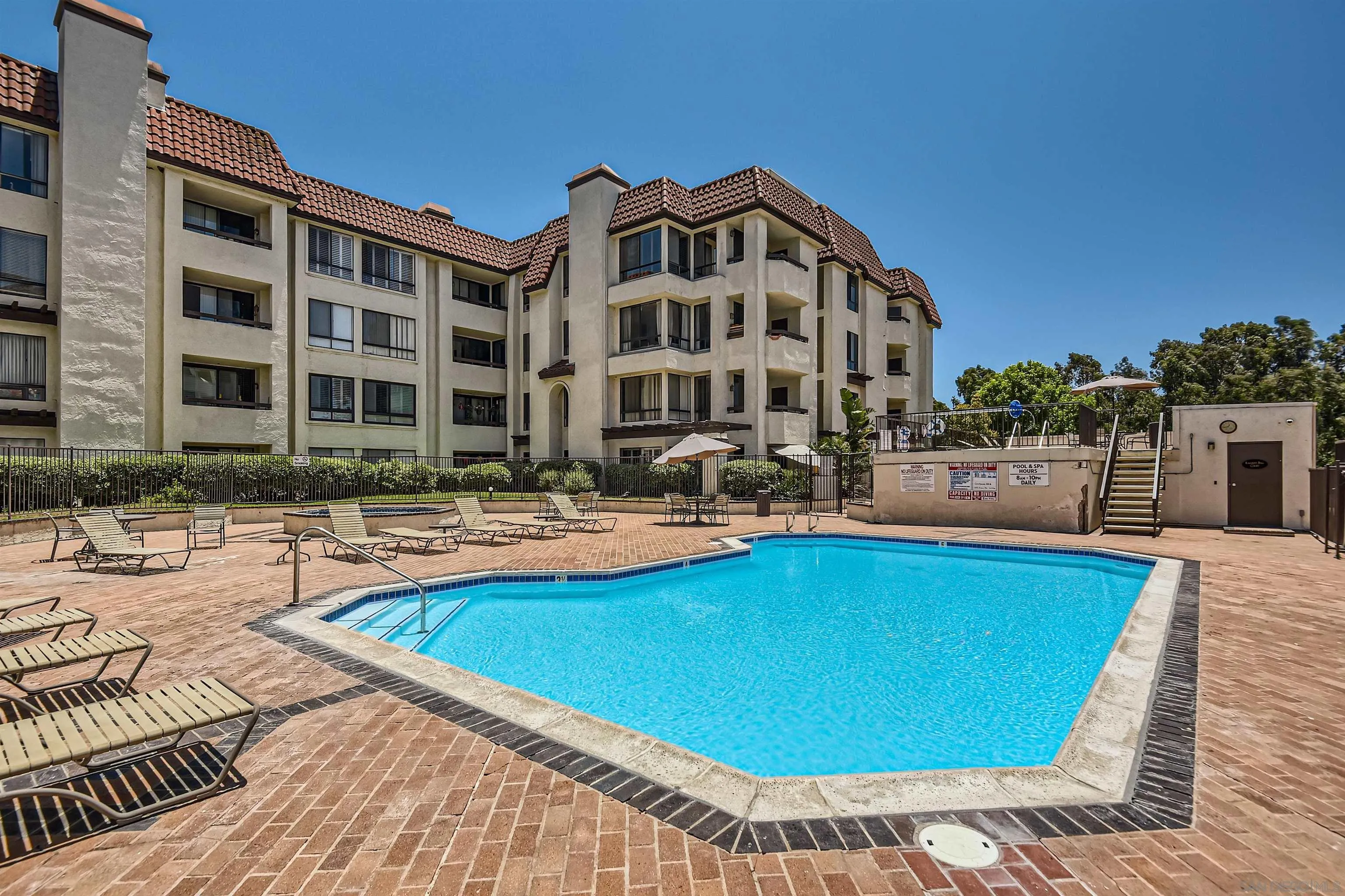 5875 Friars Road, Unit 4309 San Diego, CA 92110 - Photo 21 of 26 a view of a building with swimming pool
