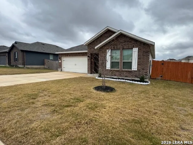 a front view of a house with yard