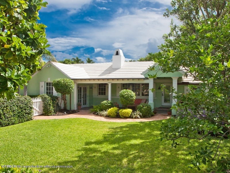 105 Dolphin Road Ocean Ridge, FL 33435 - Photo 1 of 13 a front view of a house with garden