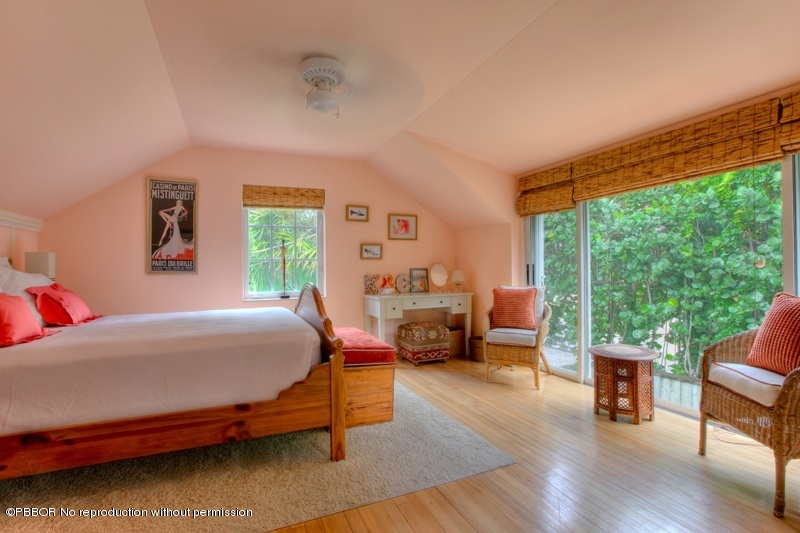105 Dolphin Road Ocean Ridge, FL 33435 - Photo 11 of 13 a bedroom with a bed and a couch