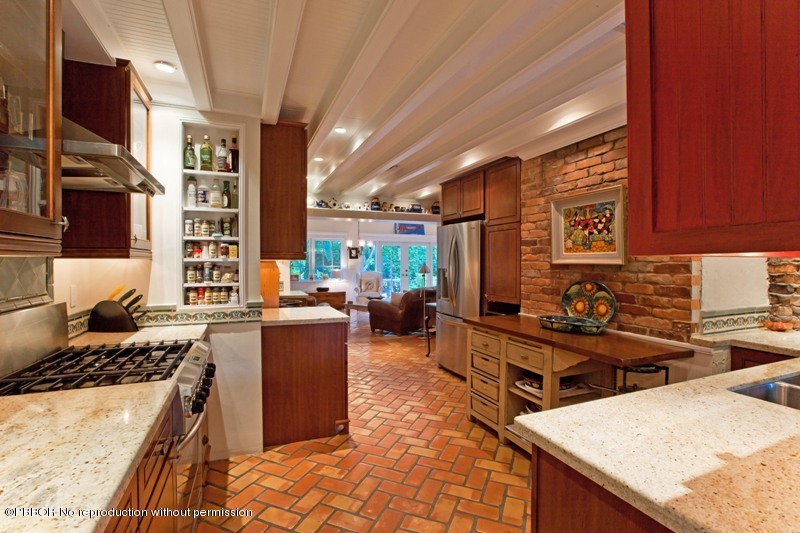 105 Dolphin Road Ocean Ridge, FL 33435 - Photo 8 of 13 a kitchen with a stove a sink and a refrigerator