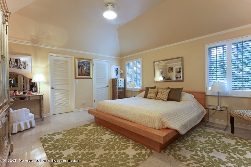 105 Dolphin Road Ocean Ridge, FL 33435 - Photo 9 of 13 a bedroom with a large bed and a couch