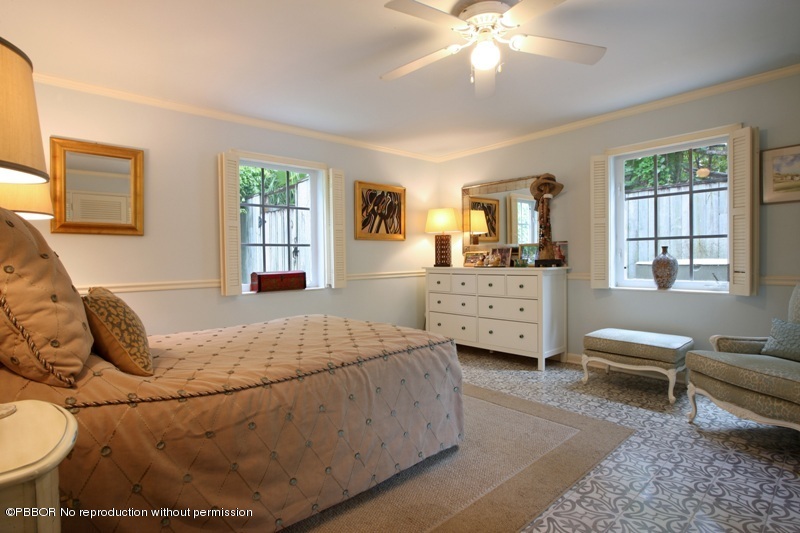 105 Dolphin Road Ocean Ridge, FL 33435 - Photo 10 of 13 a bedroom with a bed a couch and dresser