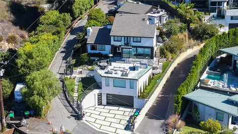 an aerial view of a house with outdoor space