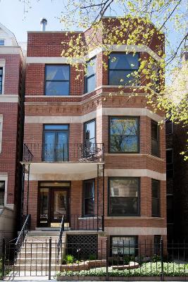 3638 North Fremont Street Chicago, IL 60613 - Photo 1 of 10 a front view of a building with glass windows and a tree