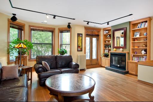 3638 North Fremont Street Chicago, IL 60613 - Photo 3 of 10 a living room with furniture a fireplace and a floor