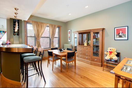 3638 North Fremont Street Chicago, IL 60613 - Photo 5 of 10 a dining room with furniture and wooden floor