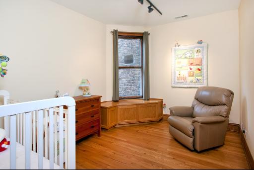 3638 North Fremont Street Chicago, IL 60613 - Photo 6 of 10 a living room with furniture and a window