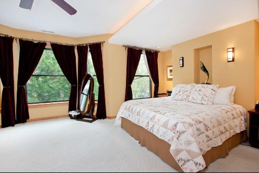 3638 North Fremont Street Chicago, IL 60613 - Photo 7 of 10 a bedroom with a bed and a large window