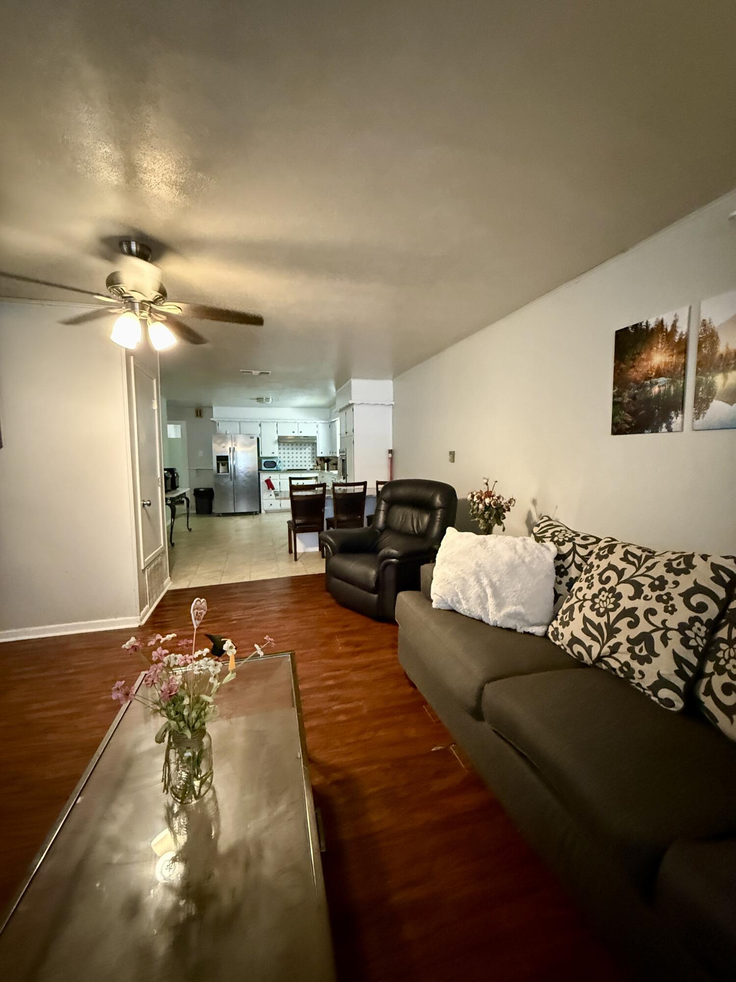 2214 40th Street Lubbock, TX 79412 - Photo 14 of 58 a living room with furniture and lamp