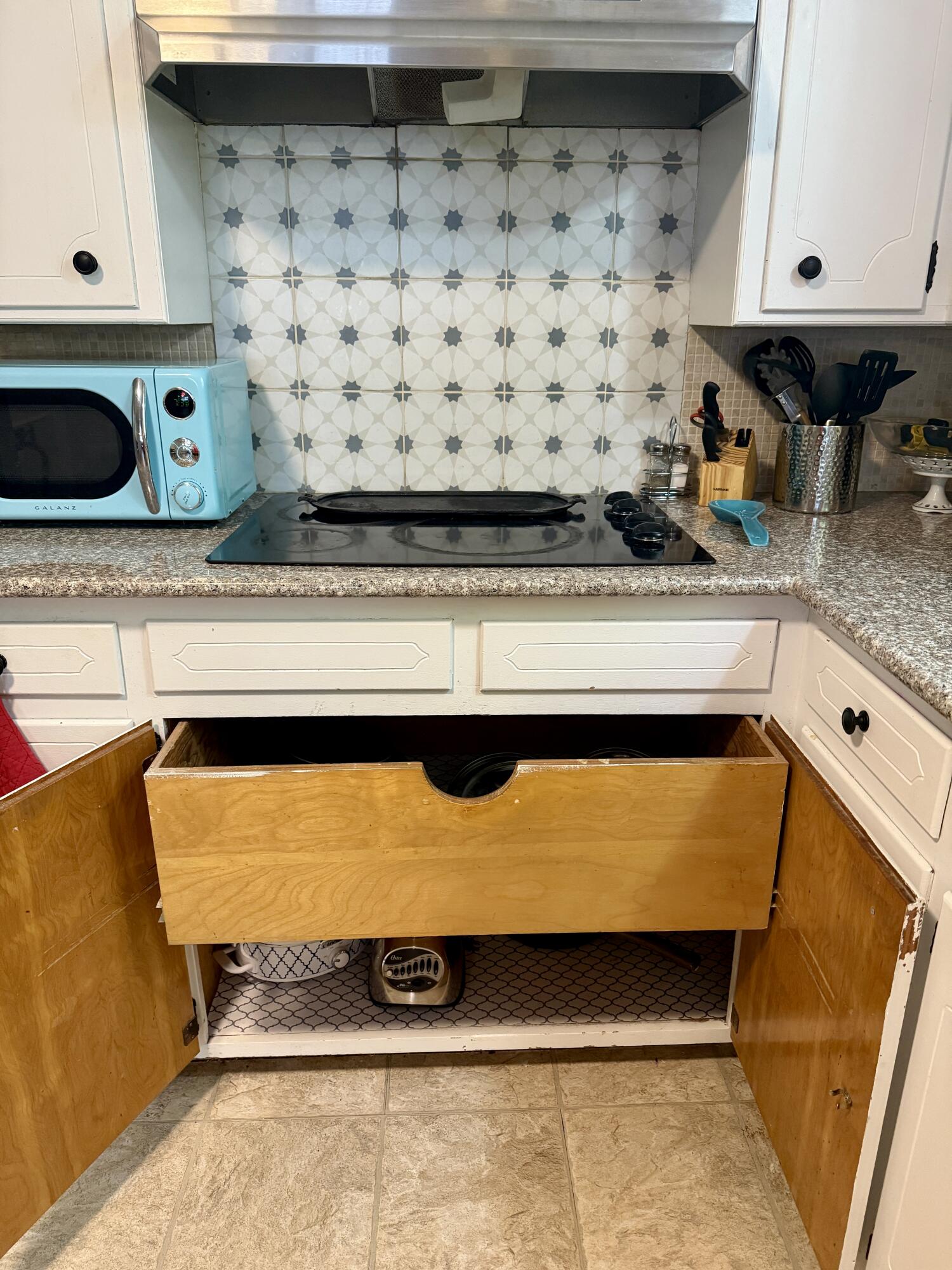 2214 40th Street Lubbock, TX 79412 - Photo 21 of 58 a bathroom with a sink and a mirror