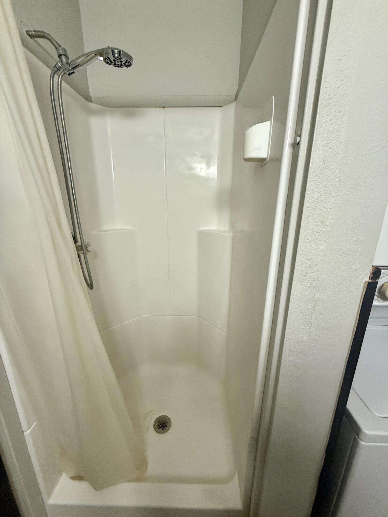 2214 40th Street Lubbock, TX 79412 - Photo 34 of 58 a bathroom with a shower