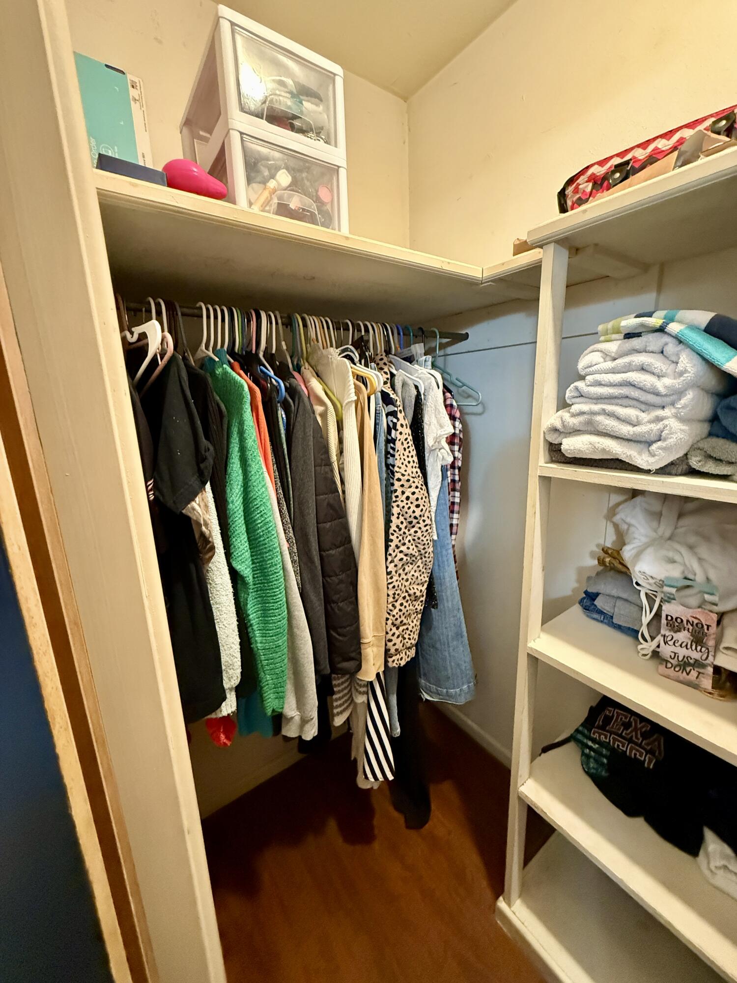 2214 40th Street Lubbock, TX 79412 - Photo 38 of 58 a view of walk in closet with clothes and shoes