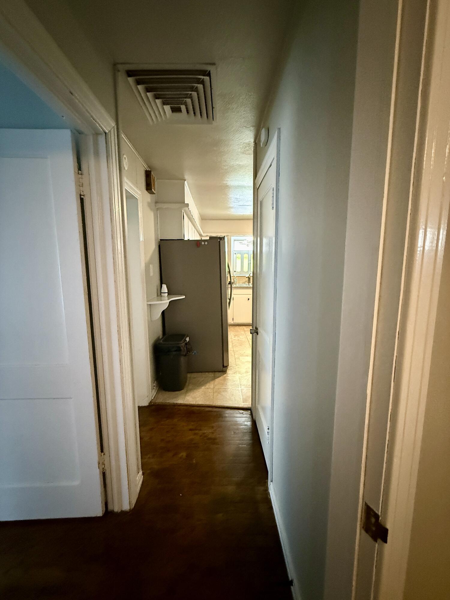 2214 40th Street Lubbock, TX 79412 - Photo 40 of 58 a view of a hallway with wooden floor