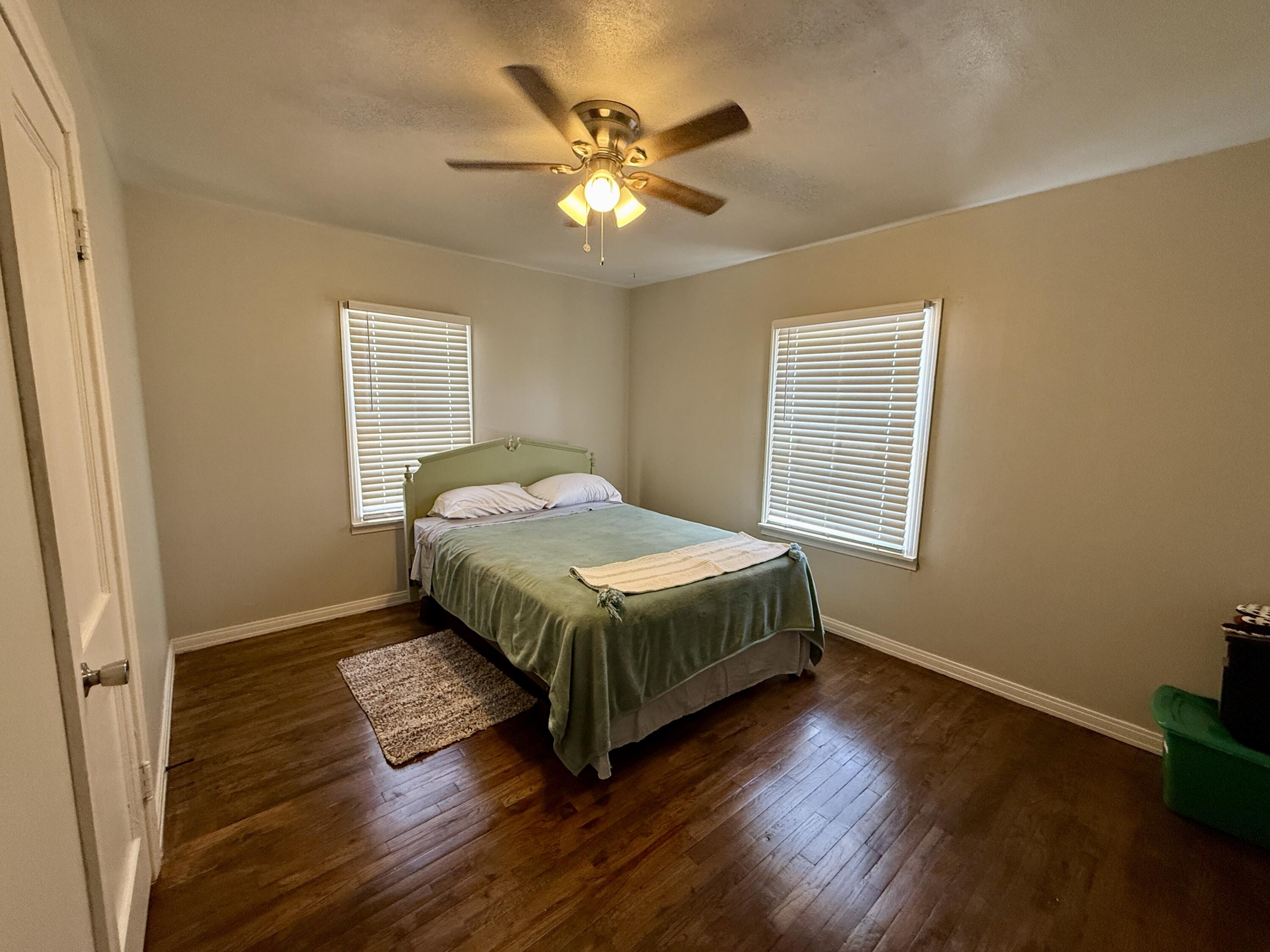 2214 40th Street Lubbock, TX 79412 - Photo 41 of 58 a bedroom with a bed and window