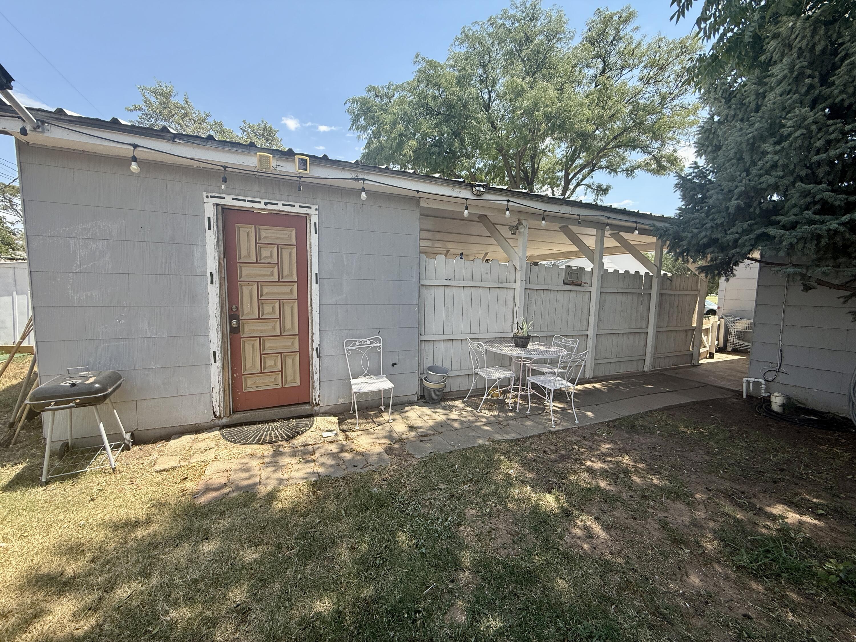 2214 40th Street Lubbock, TX 79412 - Photo 51 of 58 a backyard of a house with table and chairs