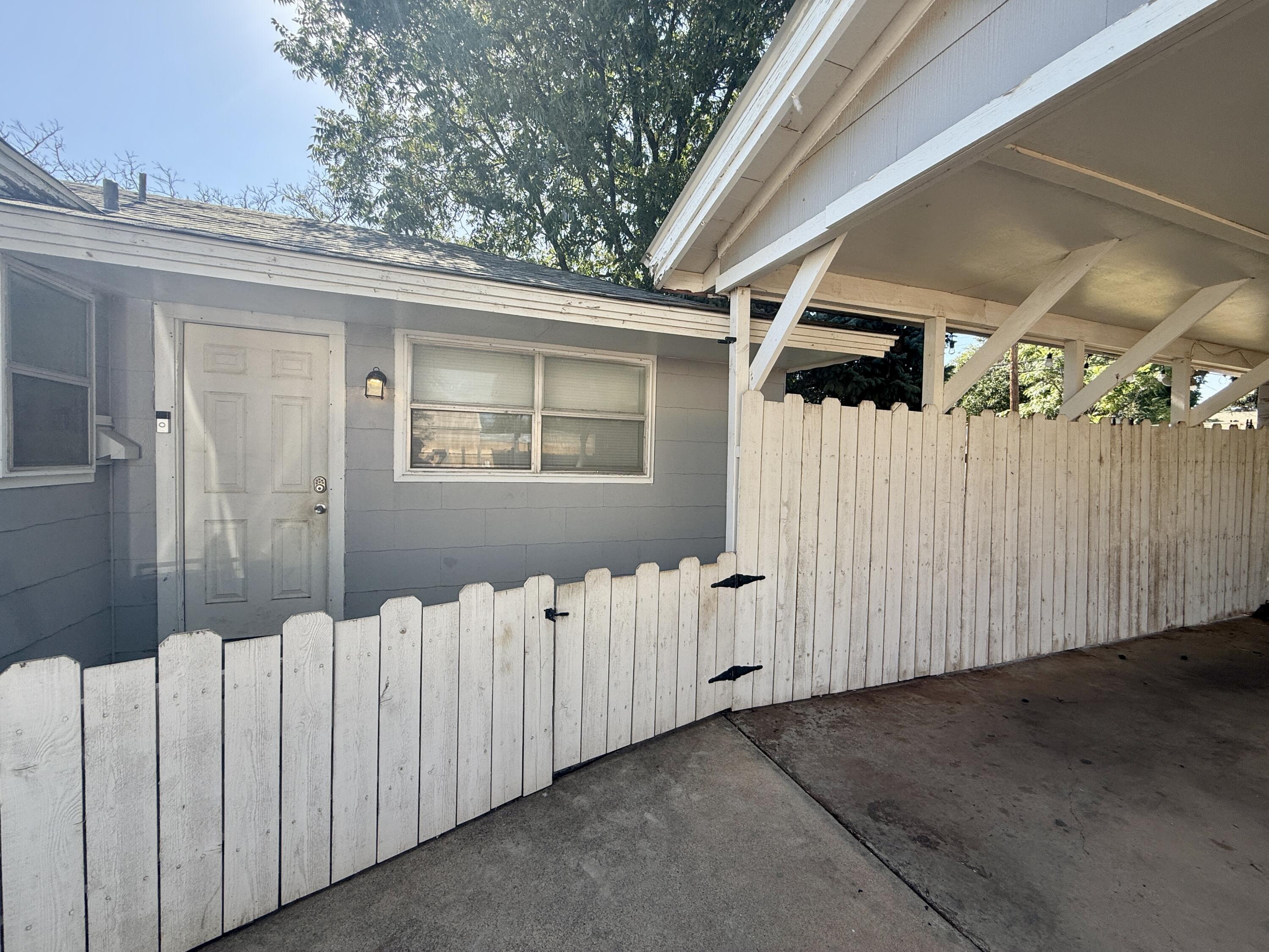 2214 40th Street Lubbock, TX 79412 - Photo 6 of 58 a view of a house with wooden fence