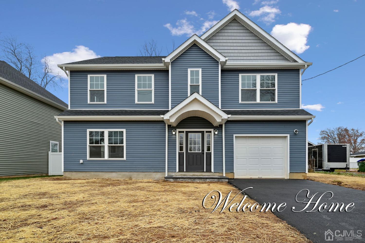 66 Runyon Avenue Edison, NJ 08817 - Photo 1 of 34 a front view of a house with a yard