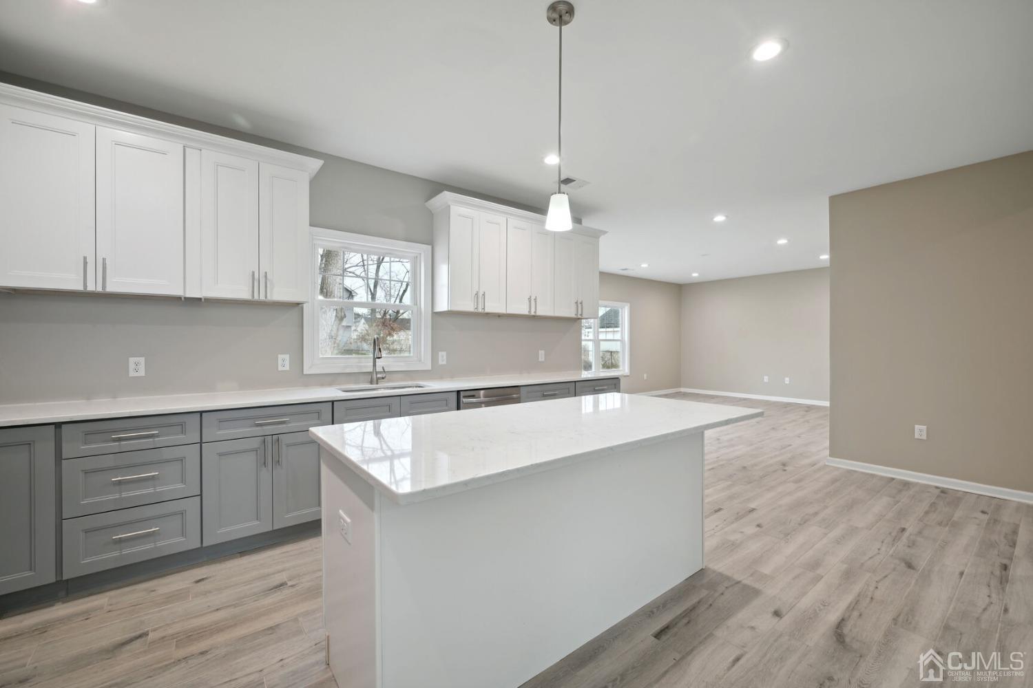 66 Runyon Avenue Edison, NJ 08817 - Photo 14 of 34 a kitchen with kitchen island sink stove and cabinets