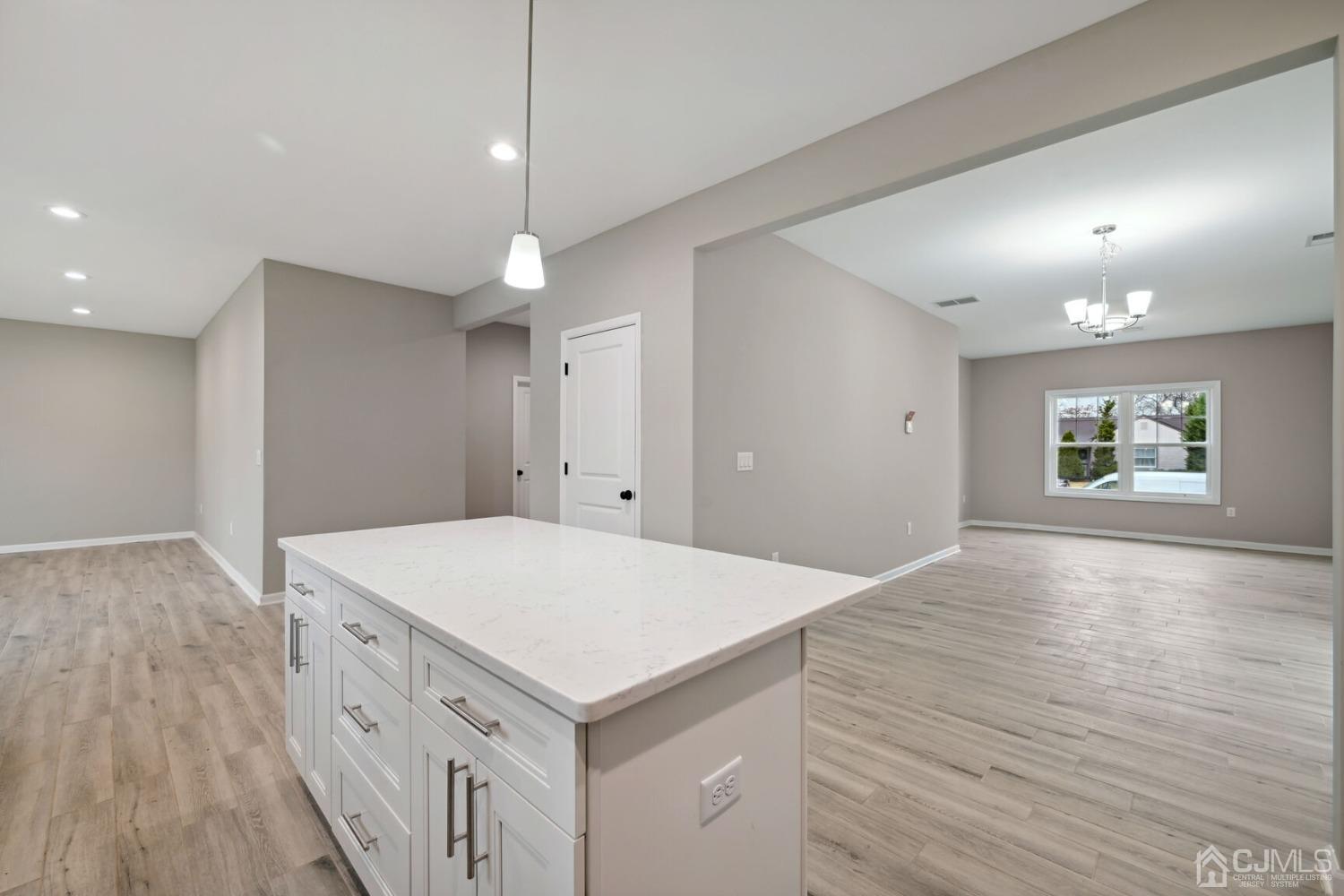 66 Runyon Avenue Edison, NJ 08817 - Photo 17 of 34 an empty room with wooden floor and windows