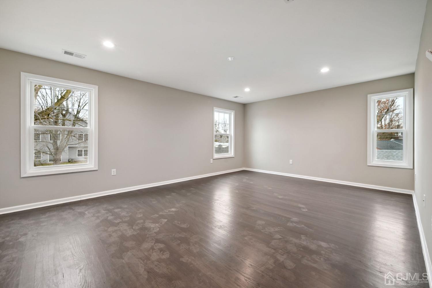 66 Runyon Avenue Edison, NJ 08817 - Photo 24 of 34 a view of an empty room with wooden floor and a window