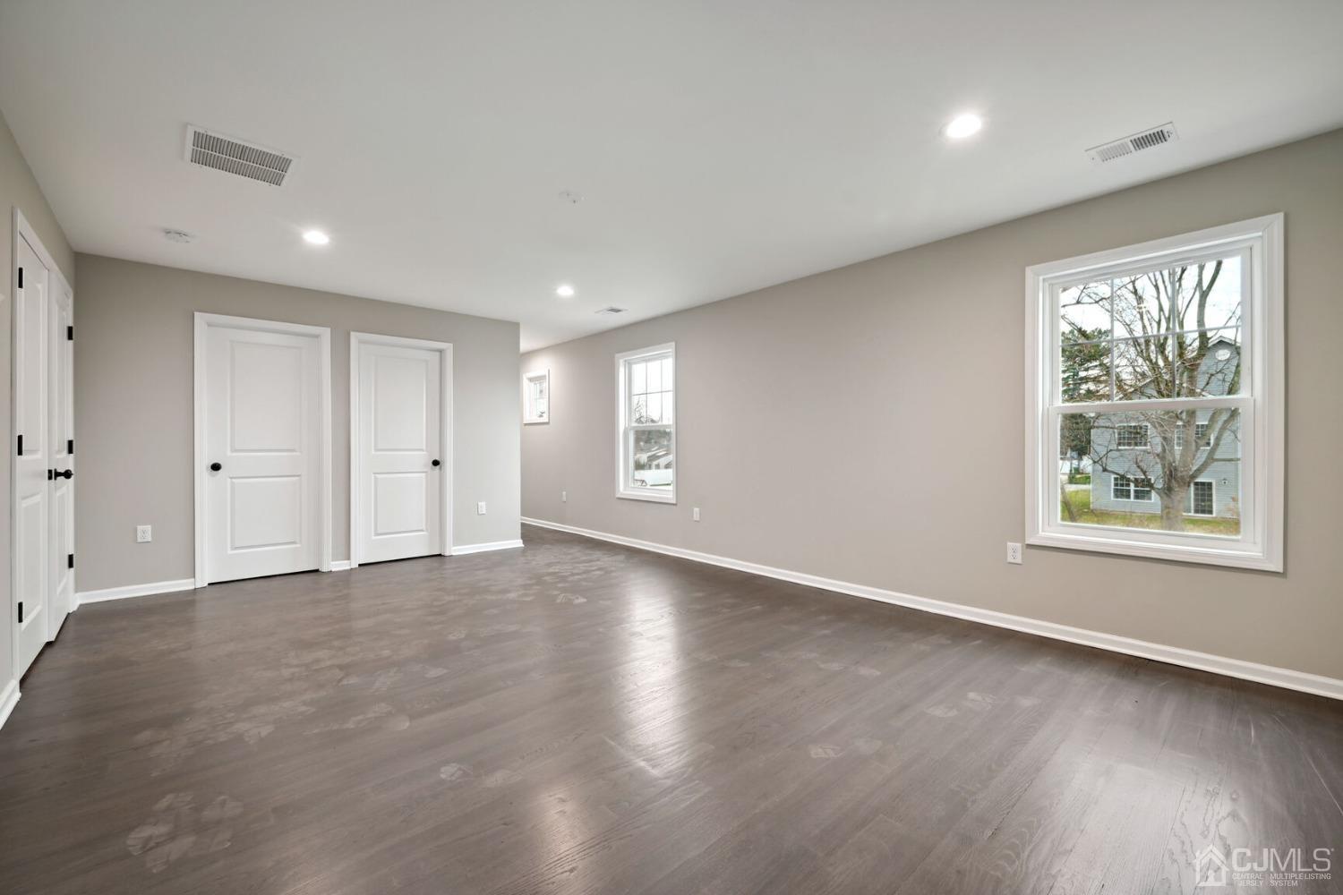 66 Runyon Avenue Edison, NJ 08817 - Photo 25 of 34 a view of an empty room with wooden floor and a window