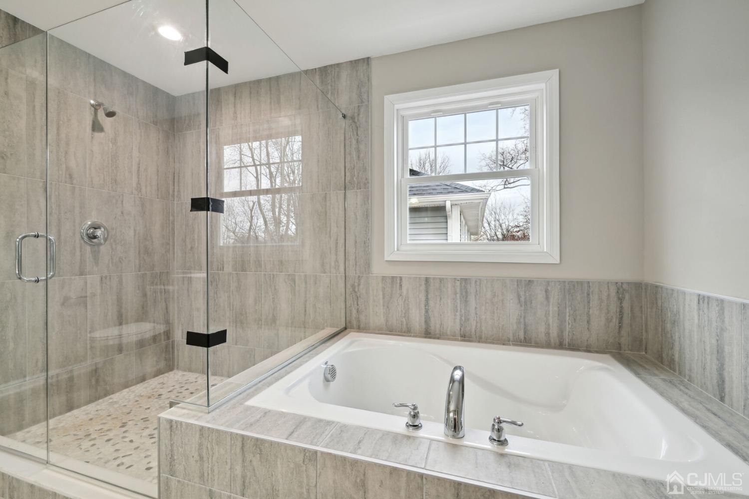 66 Runyon Avenue Edison, NJ 08817 - Photo 30 of 34 a bath tub sitting next to a window