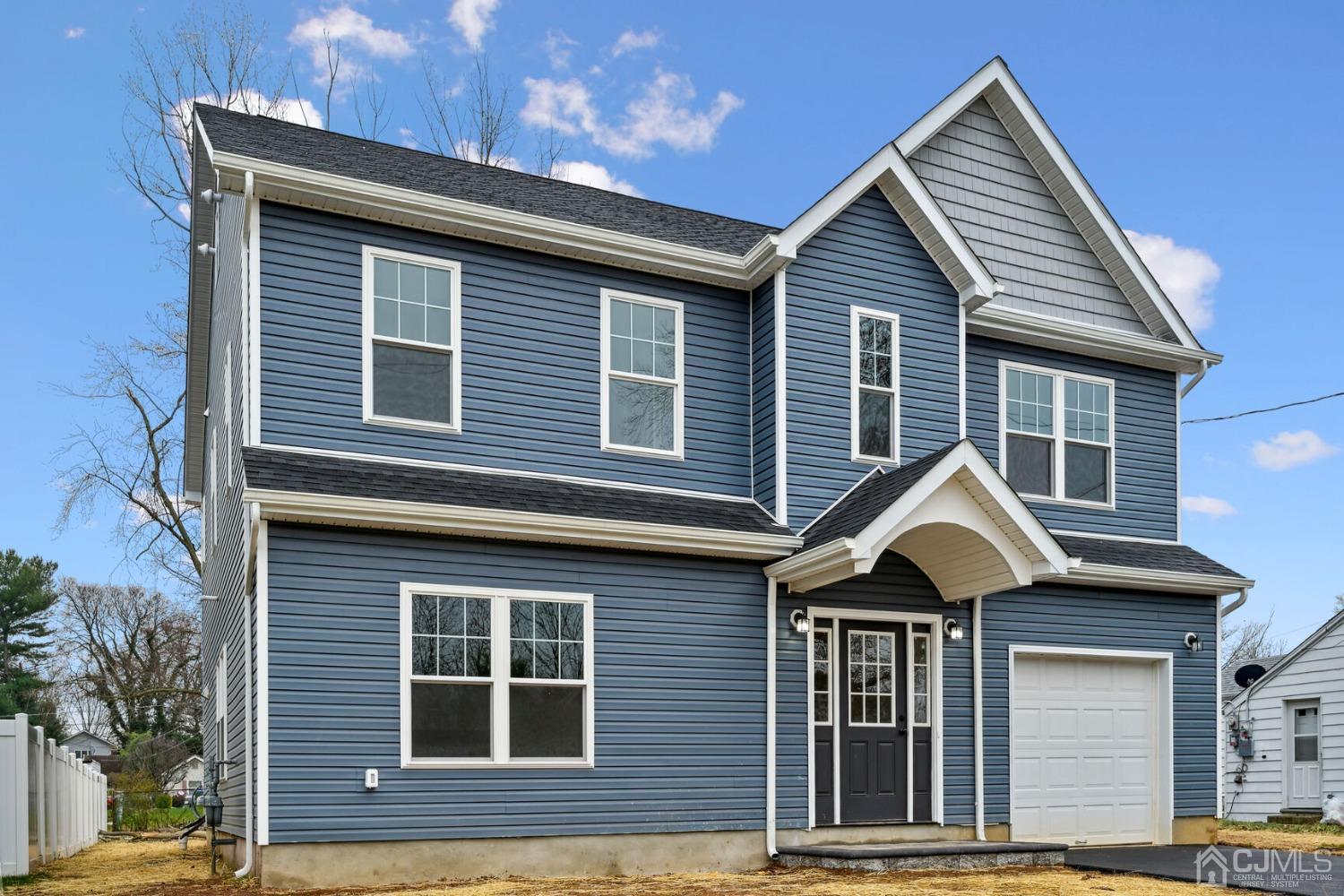 66 Runyon Avenue Edison, NJ 08817 - Photo 4 of 34 a front view of a house with a yard