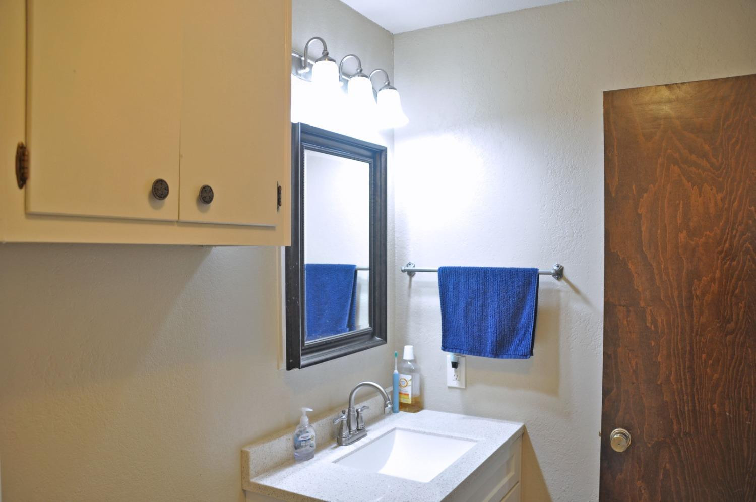 1511 Ave J Abernathy, TX 79311 - Photo 20 of 24 a bathroom with a sink and a mirror
