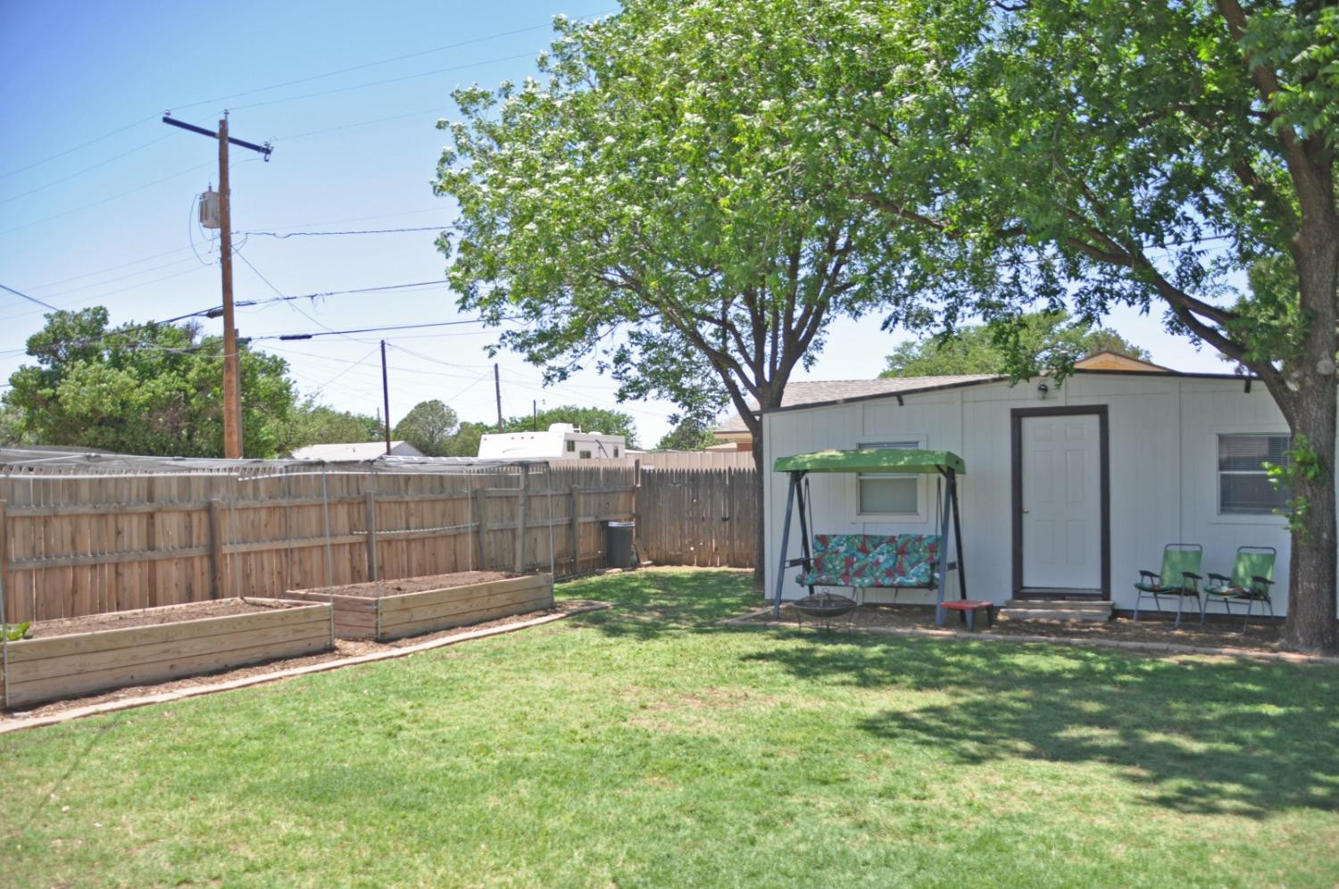1511 Ave J Abernathy, TX 79311 - Photo 22 of 24 a view of a backyard with a large tree