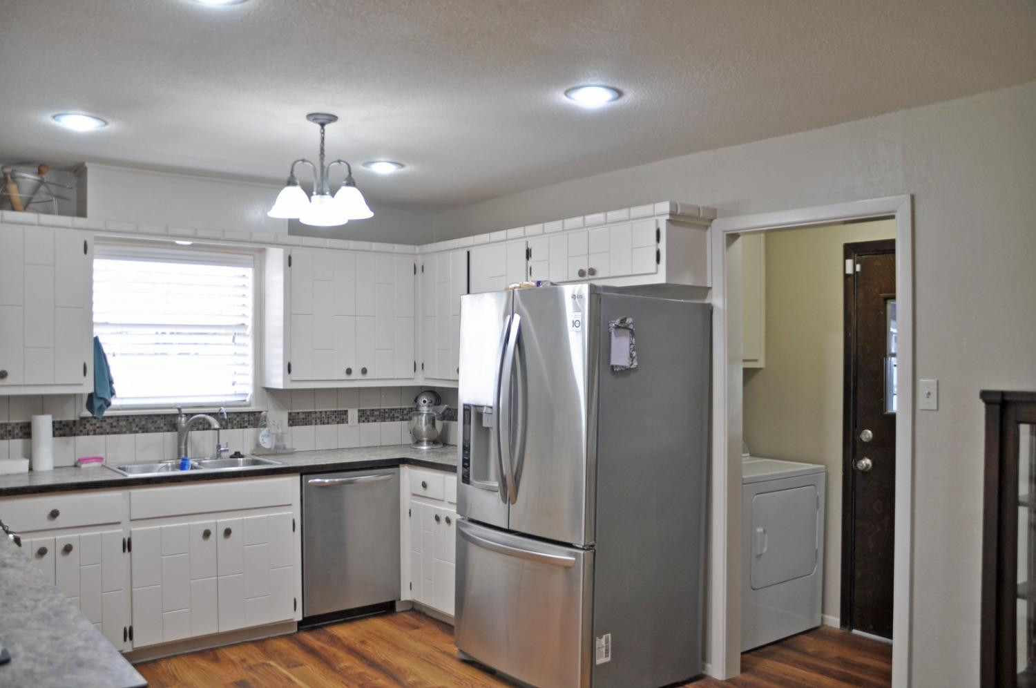 1511 Ave J Abernathy, TX 79311 - Photo 8 of 24 a kitchen with stainless steel appliances a refrigerator sink and cabinets