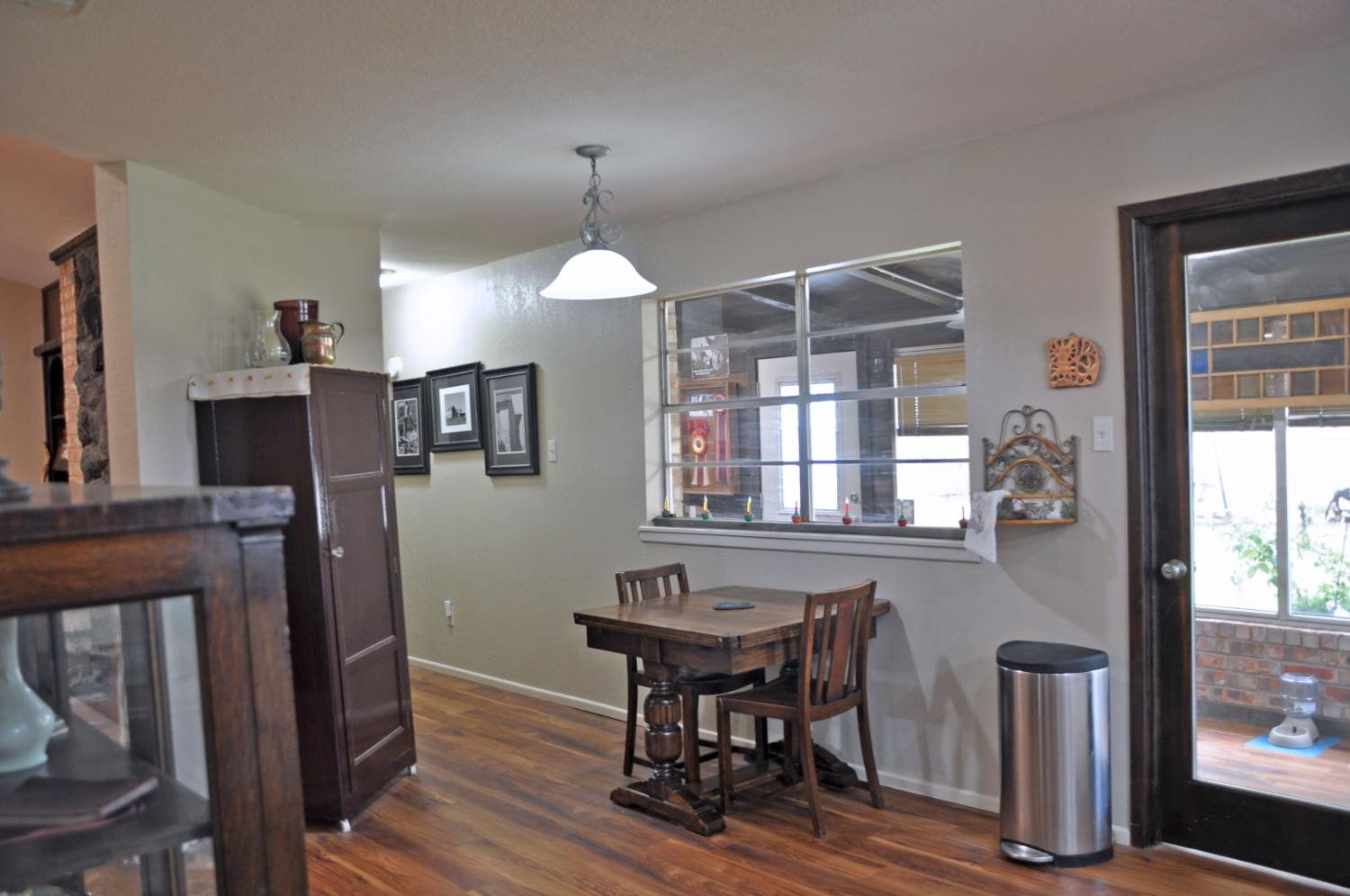 1511 Ave J Abernathy, TX 79311 - Photo 10 of 24 a view of a a dining room with furniture window and wooden floor