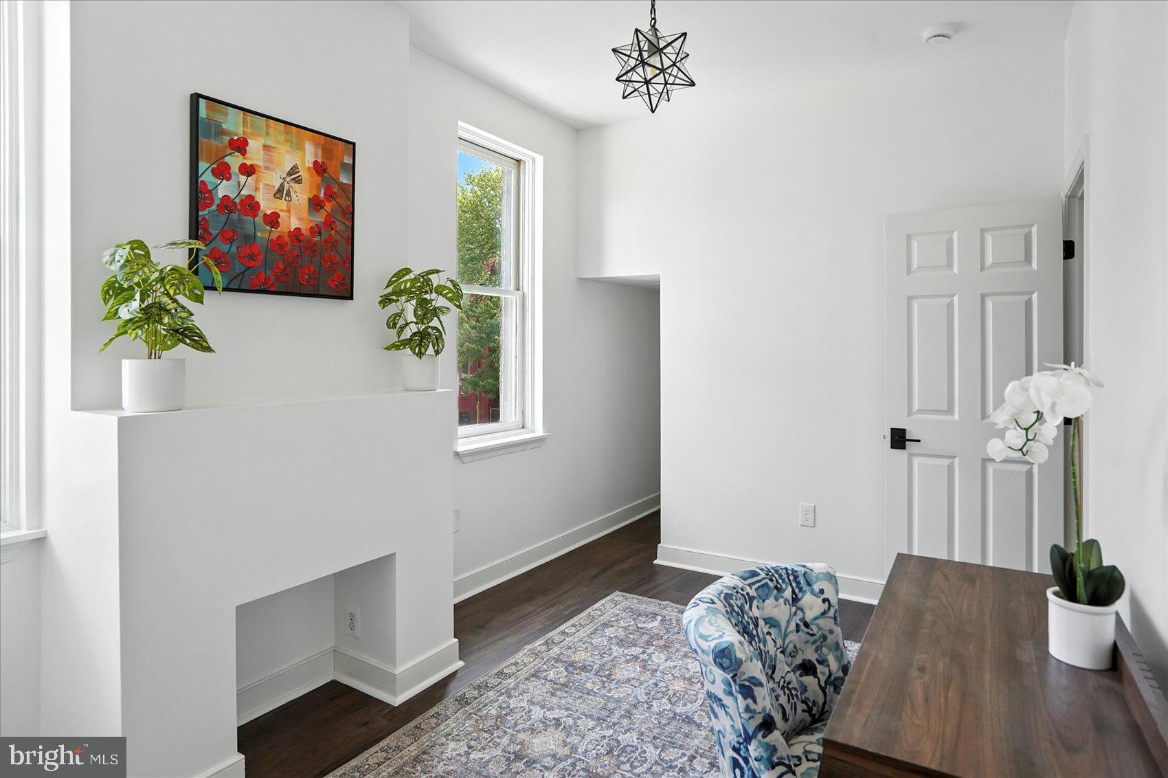 416 Mosher Street Baltimore, MD 21217 - Photo 22 of 38 a view of bedroom with furniture and wooden floor
