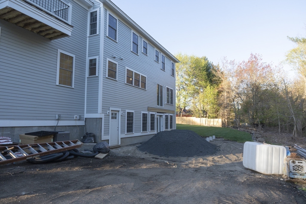 28 Marion Road Rochester, MA 02770 - Photo 23 of 23 a view of a house with a yard and sitting area