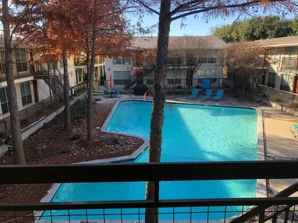 a view of a swimming pool with a patio