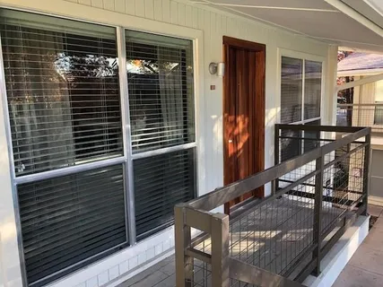 a view of balcony with two chairs