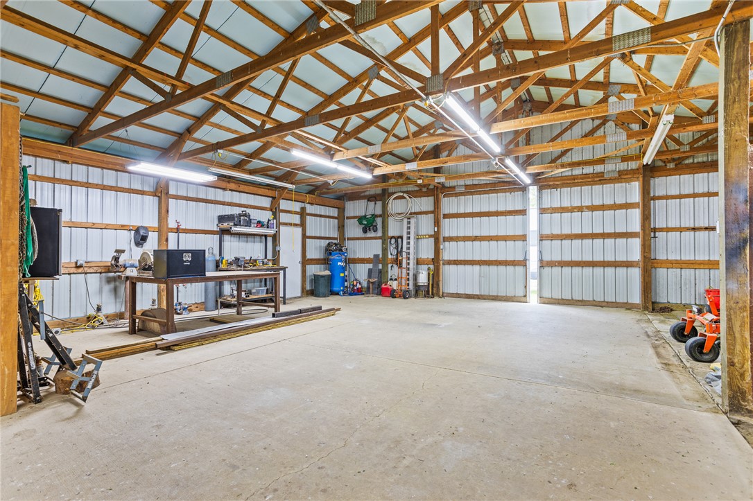 4222 Ramsey Road Springfield, OH 45502 - Photo 73 of 79 This spacious workshop offers ample room for projects and storage, featuring durable concrete flooring.