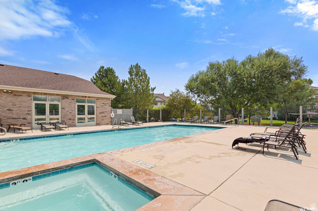 8116 North Ridge Loop West, Unit 8 Eagle Mountain, UT 84005 - Photo 21 of 23 Community pool with a patio and a community hot tub