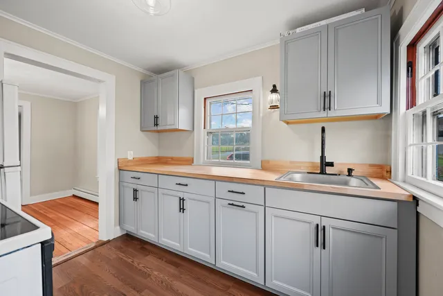 a kitchen with cabinets a sink and dishwasher