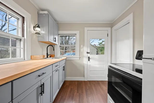 a kitchen with a sink and cabinets