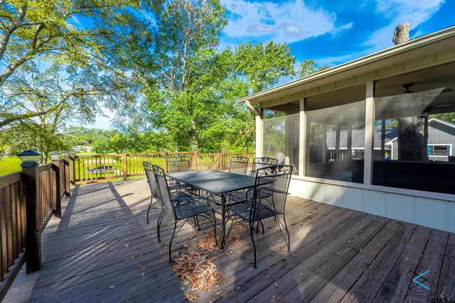 a view of a patio with a table and chairs