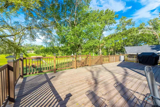 a balcony with wooden floor